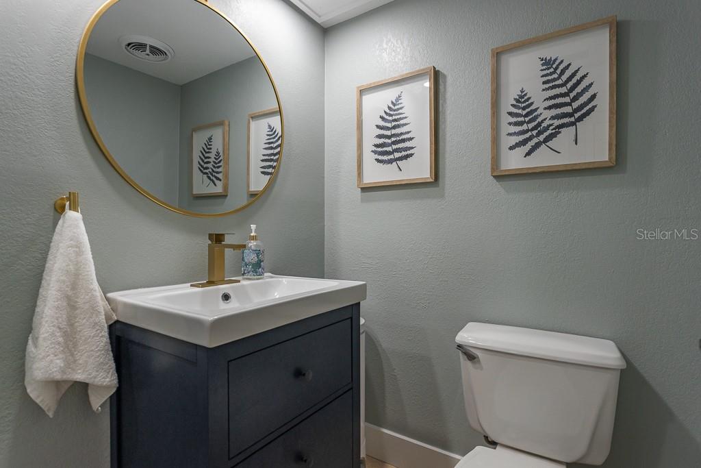 100 Ingrid Place Oldsmar, FL 34677 - Photo 27 of 51 a bathroom with a toilet a sink and mirror