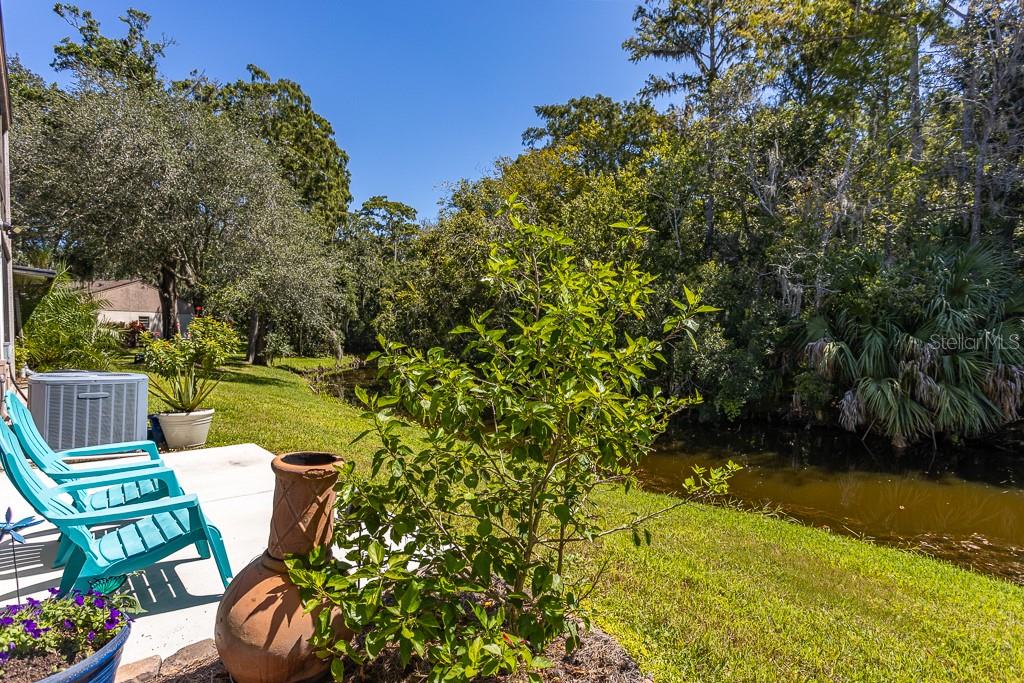 100 Ingrid Place Oldsmar, FL 34677 - Photo 29 of 51 a view of a chair and table on the patio
