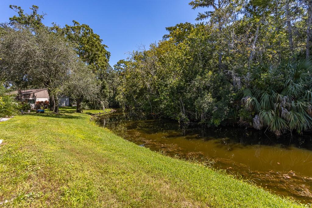 100 Ingrid Place Oldsmar, FL 34677 - Photo 30 of 51 a view of a swimming pool with an outdoor space and seating area