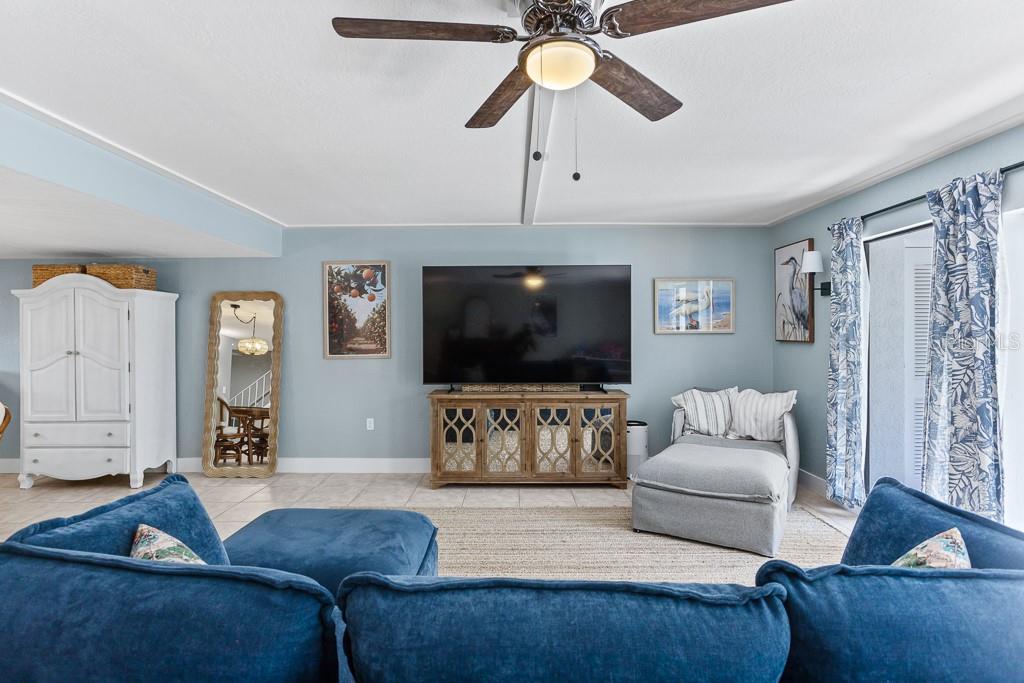 100 Ingrid Place Oldsmar, FL 34677 - Photo 3 of 51 a living room with furniture and a flat screen tv