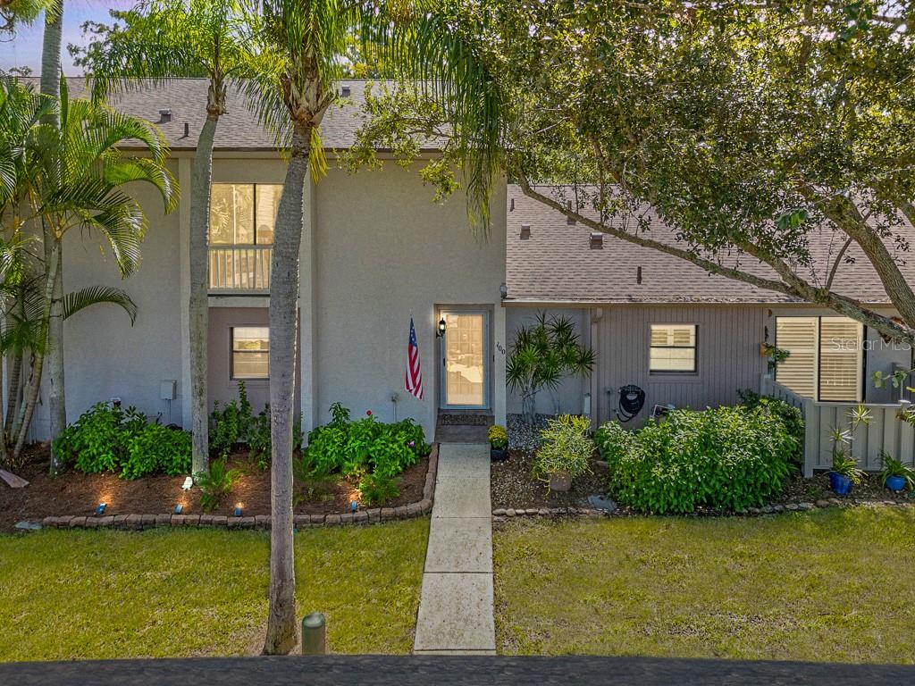 100 Ingrid Place Oldsmar, FL 34677 - Photo 36 of 51 a view of a house with pool plants and large trees