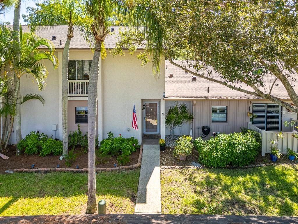 100 Ingrid Place Oldsmar, FL 34677 - Photo 37 of 51 a front view of a house with garden