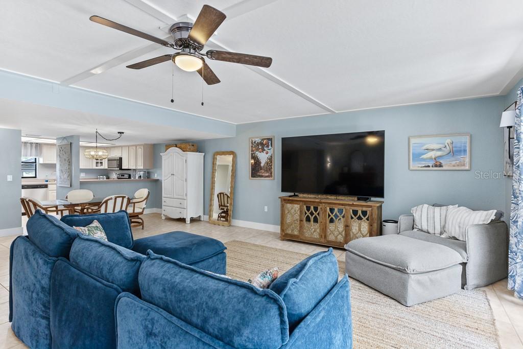100 Ingrid Place Oldsmar, FL 34677 - Photo 4 of 51 a living room with furniture and a flat screen tv