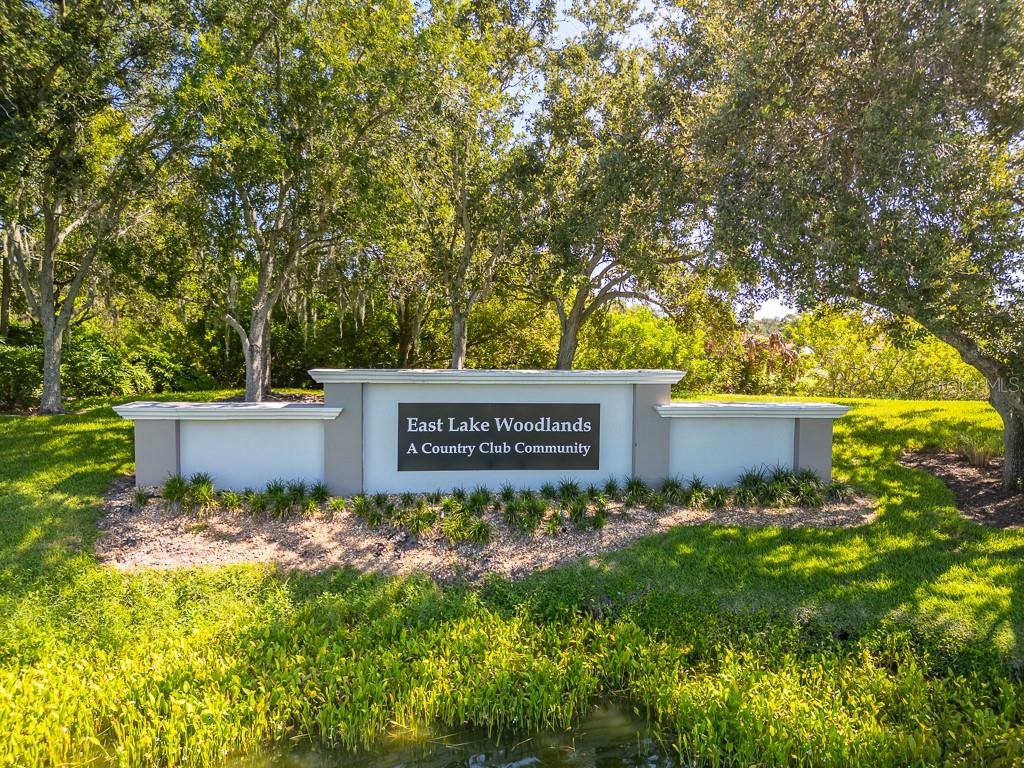 100 Ingrid Place Oldsmar, FL 34677 - Photo 43 of 51 a sign that is sitting in front of a tree