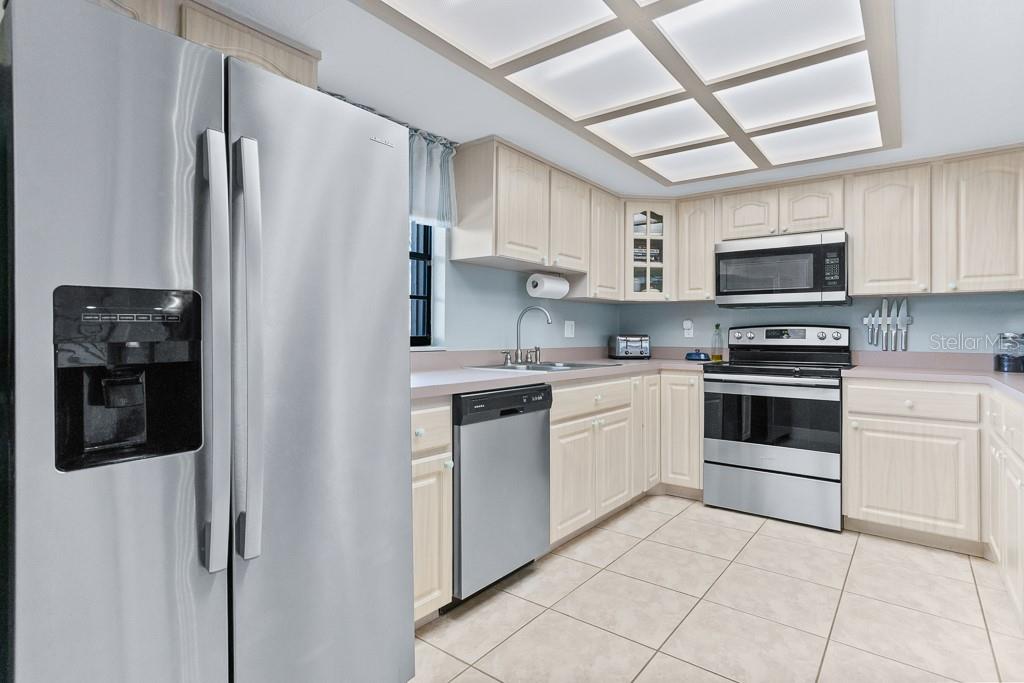 100 Ingrid Place Oldsmar, FL 34677 - Photo 10 of 51 a kitchen with stainless steel appliances and cabinets