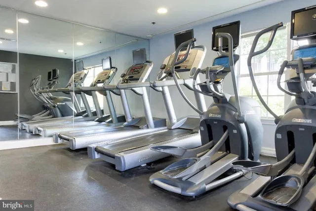 a gym room with gym equipment