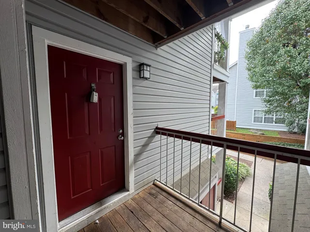 a view of a balcony with wooden floor