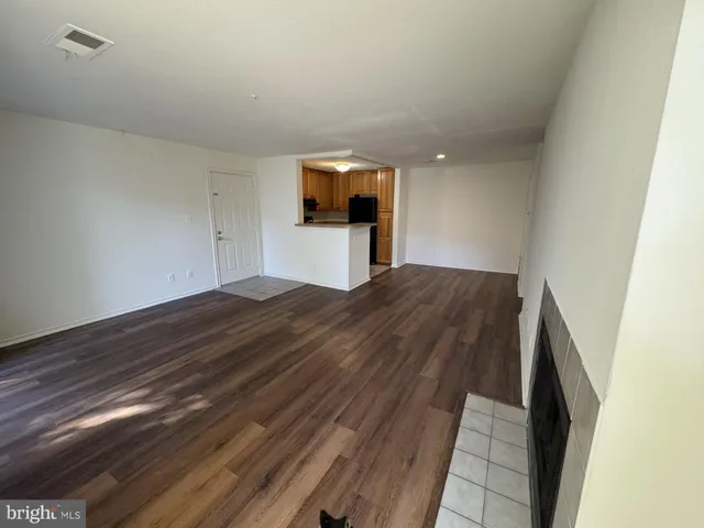 a bedroom with a bed and a night stand