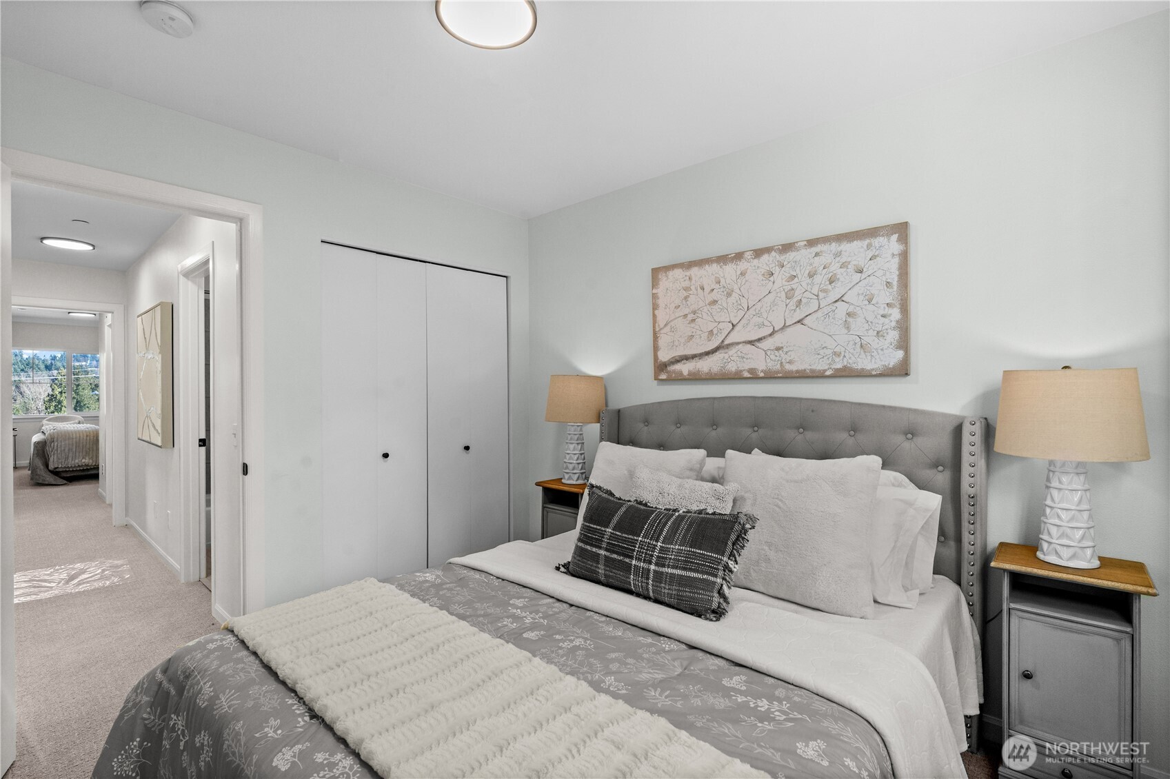 23202 Fitzgerald Road, Unit 1 Bothell, WA 98021 - Photo 14 of 21 a bedroom with a bed and a lamp