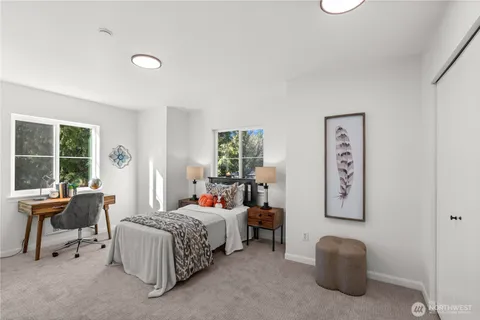 a bedroom with bed and a window