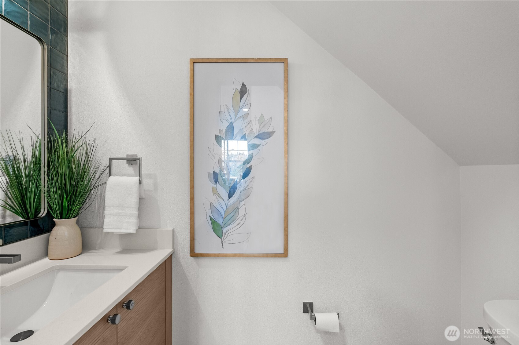 23202 Fitzgerald Road, Unit 1 Bothell, WA 98021 - Photo 17 of 21 a bathroom with a sink a toilet and mirror