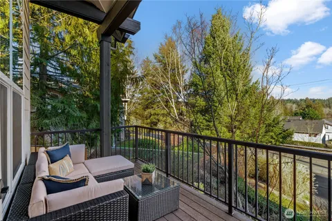a view of roof deck with couches