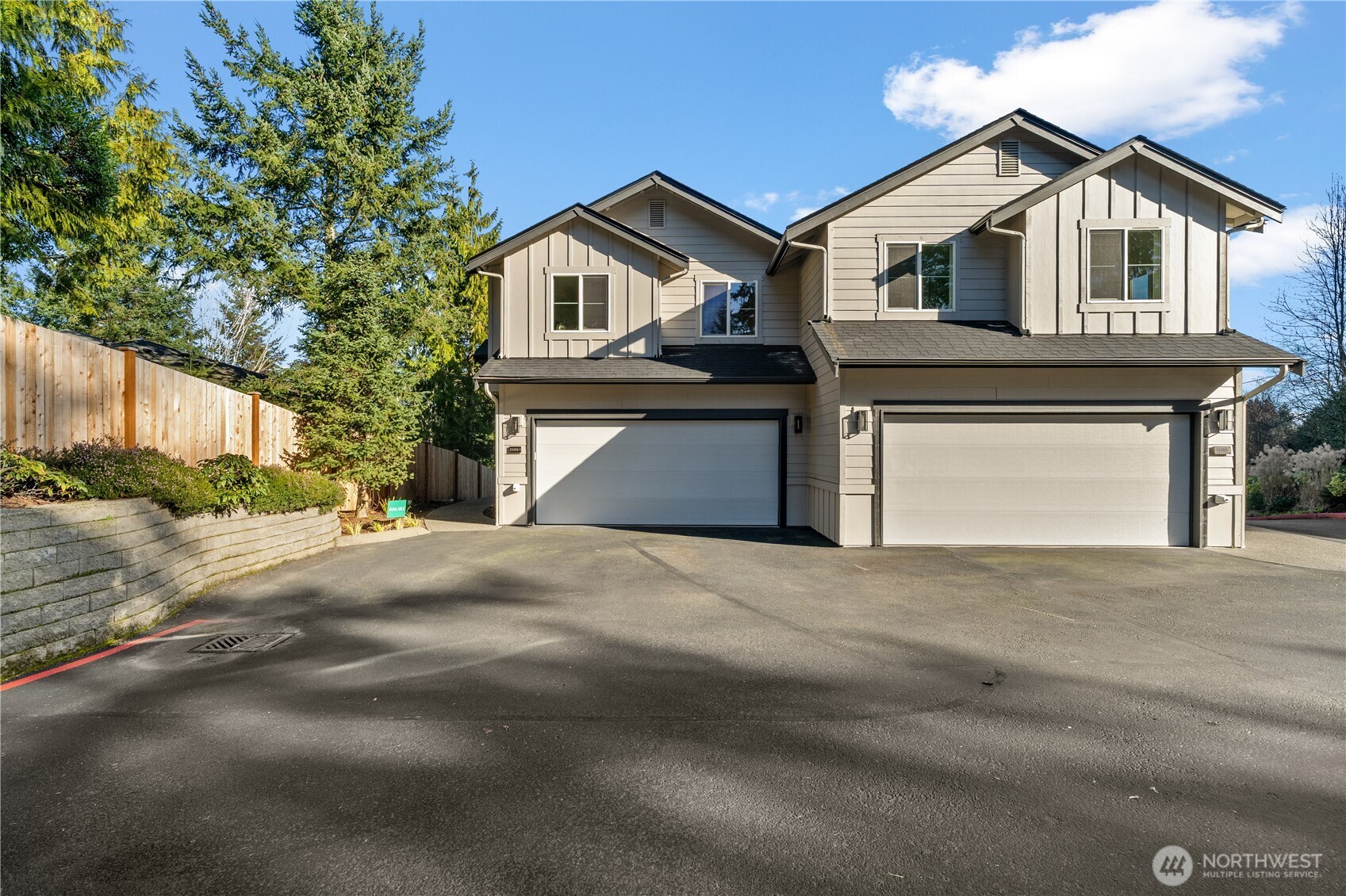 23202 Fitzgerald Road, Unit 1 Bothell, WA 98021 - Photo 21 of 21 a front view of a house with a yard and garage