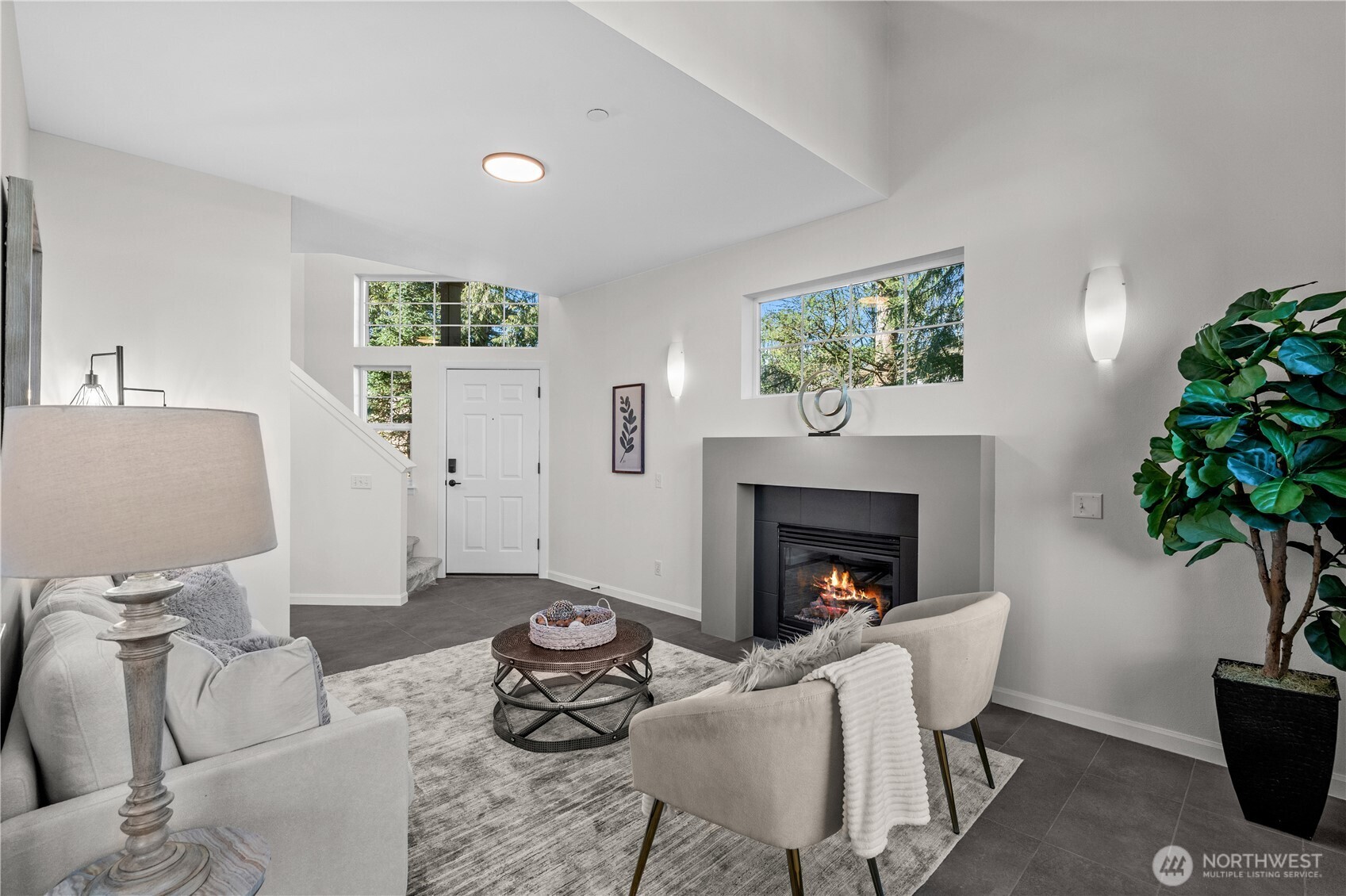 23202 Fitzgerald Road, Unit 1 Bothell, WA 98021 - Photo 3 of 21 a living room with furniture and a fireplace