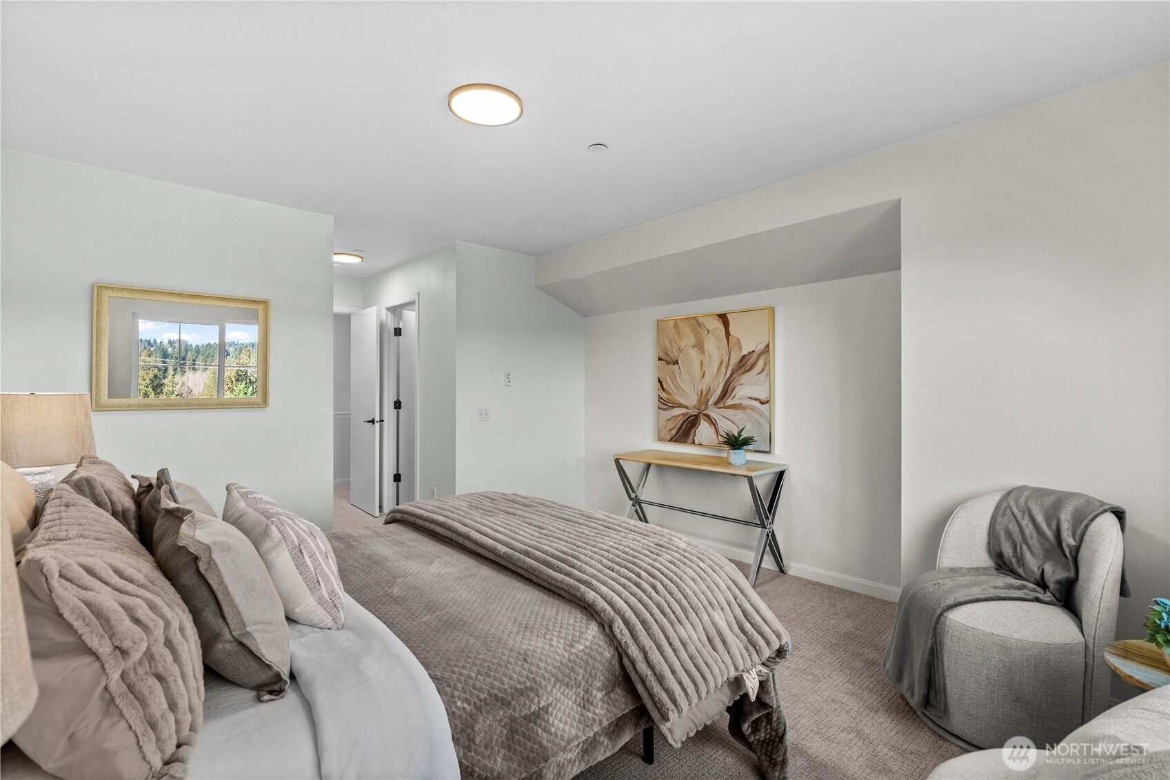 23202 Fitzgerald Road, Unit 1 Bothell, WA 98021 - Photo 10 of 21 a bedroom with a bed and a couch