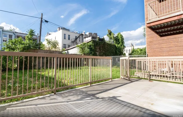 a view of a wrought iron fences in front of house