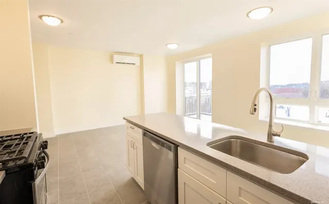 a kitchen with a sink and a window