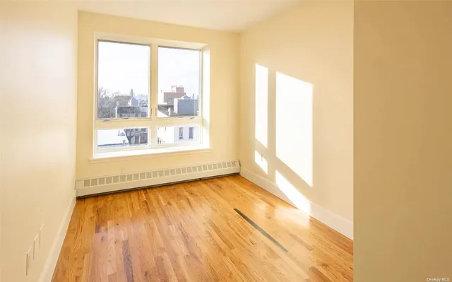 a view of an empty room and a window