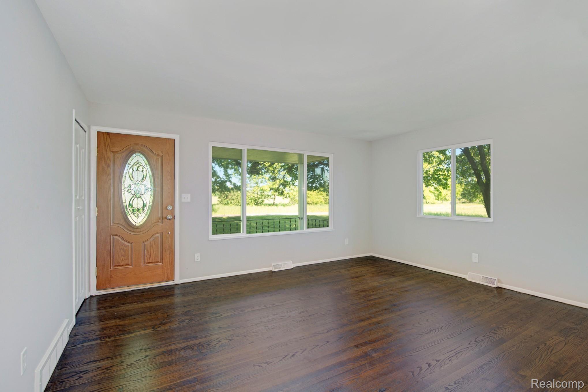3680 North Gregory Road Fowlerville, MI 48836 - Photo 7 of 24 Living room has gorgeous hardwood flooring