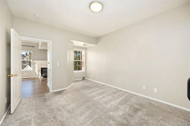 a view of a balcony with wooden fence