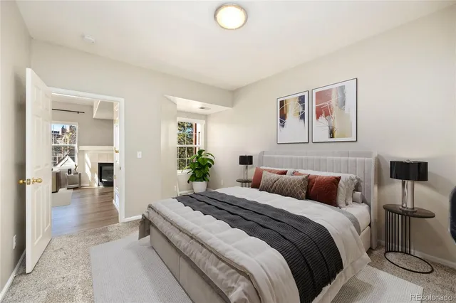 a bedroom with a bed and a lamp