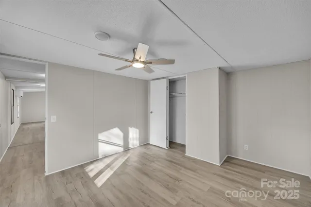 a view of a livingroom with a chandelier fan