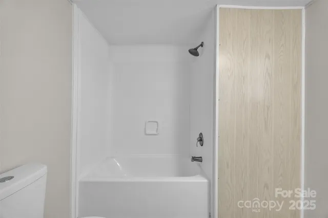 a close up of a bathtub curtain