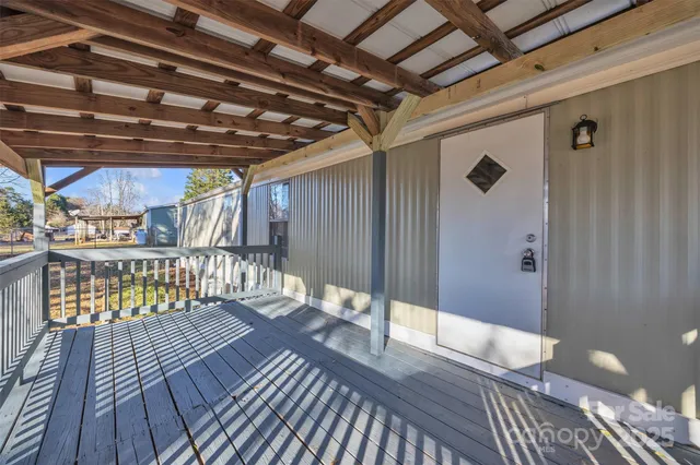a view of a balcony with wooden floor