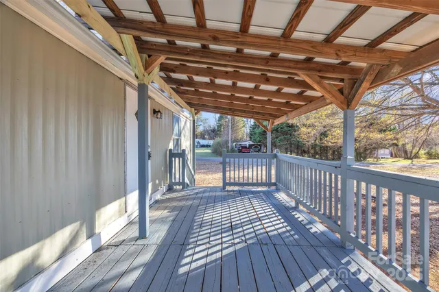 a view of porch with wooden floor