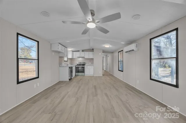 a view of workspace with window and wooden floor