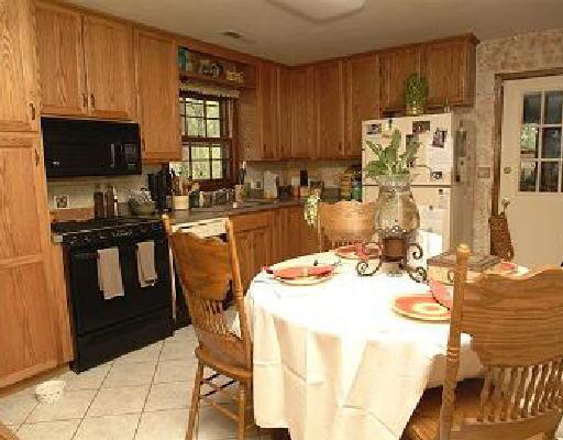 1036 Rudy Court Goodview, VA 24095 - Photo 3 of 5 a kitchen with a sink appliances and cabinets