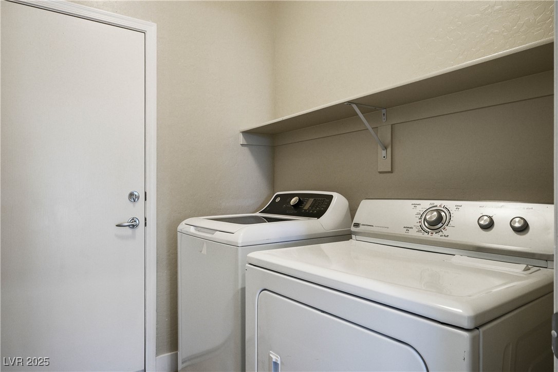 2563 Sargon Street Henderson, NV 89044 - Photo 14 of 35 Laundry room featuring washing machine and dryer