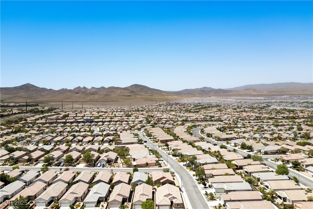 2563 Sargon Street Henderson, NV 89044 - Photo 29 of 35 Aerial perspective of suburban area featuring a mountainous background