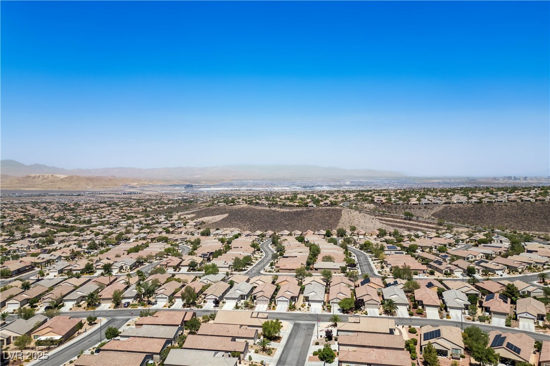 2563 Sargon Street Henderson, NV 89044 - Photo 30 of 35 Aerial perspective of suburban area with mountains