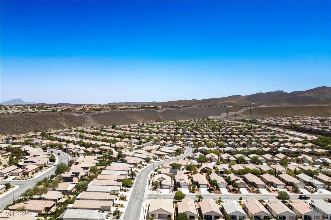 2563 Sargon Street Henderson, NV 89044 - Photo 32 of 35 Aerial perspective of suburban area featuring a mountain backdrop