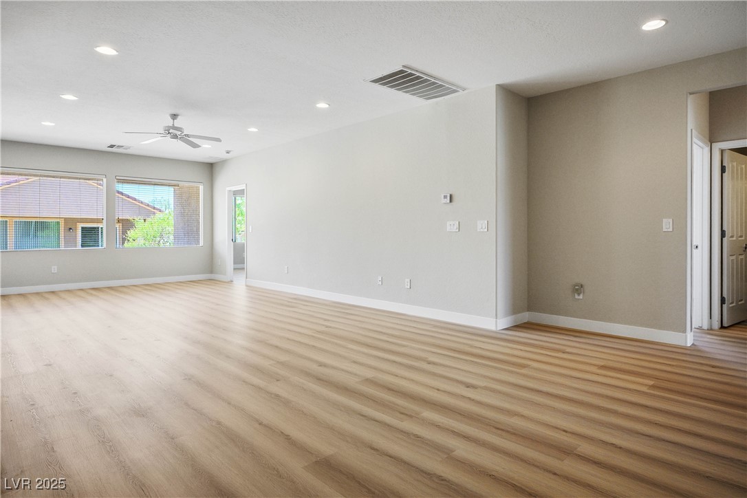 2563 Sargon Street Henderson, NV 89044 - Photo 6 of 35 Spare room featuring light wood-style flooring, recessed lighting, and ceiling fan