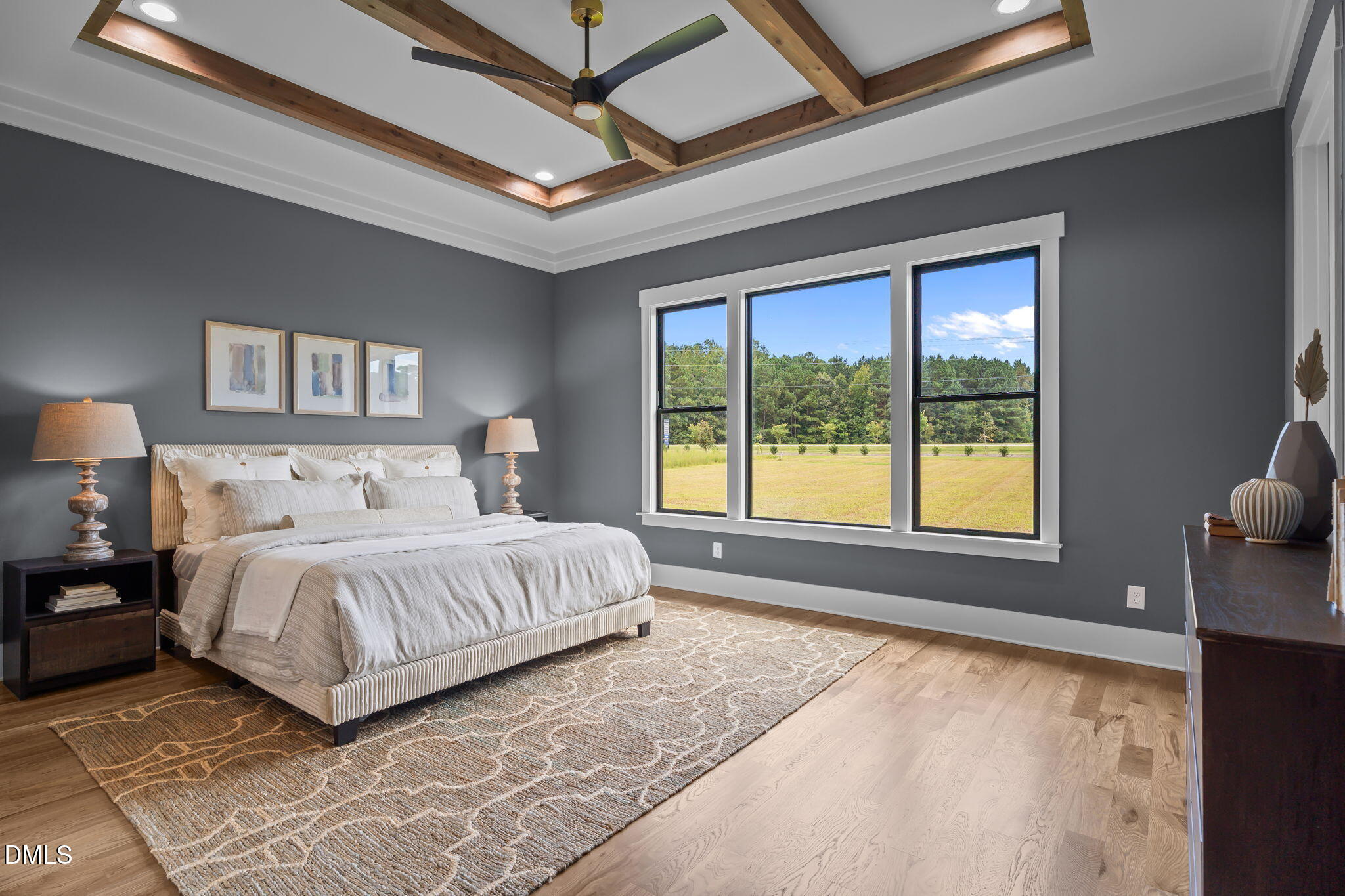200 Broadleaf Lane Louisburg, NC 27549 - Photo 14 of 57 a bedroom with a large bed and a large window