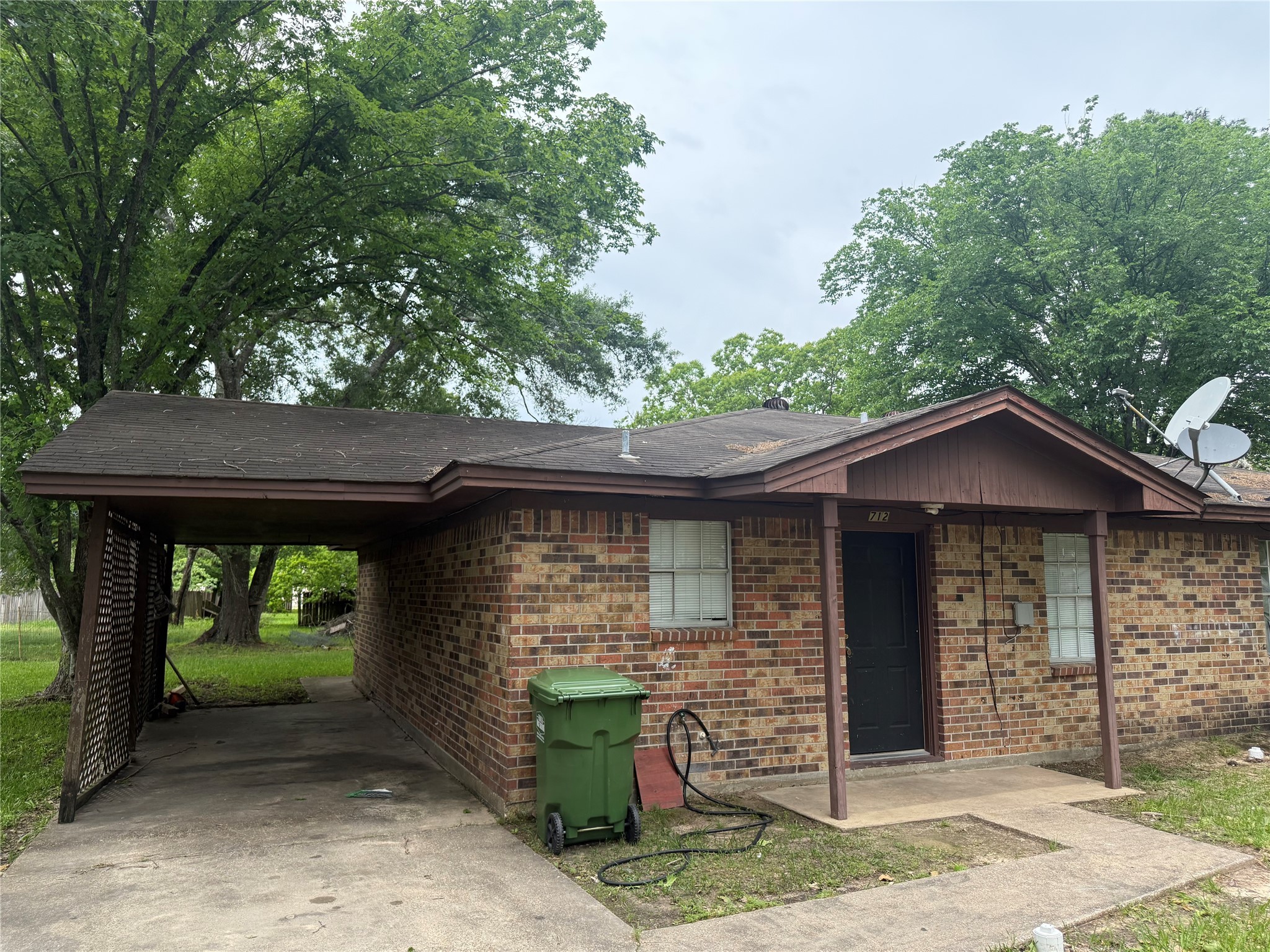 710 Lyle W Avenue, Unit 712 Cleveland, TX 77327 - Photo 2 of 9 a front view of a house with garden