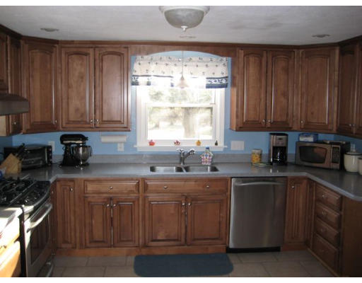 60 Wyman Road Billerica, MA 01821 - Photo 1 of 1 a kitchen with stainless steel appliances granite countertop a sink a stove a refrigerator a sink and dishwasher with wooden floor