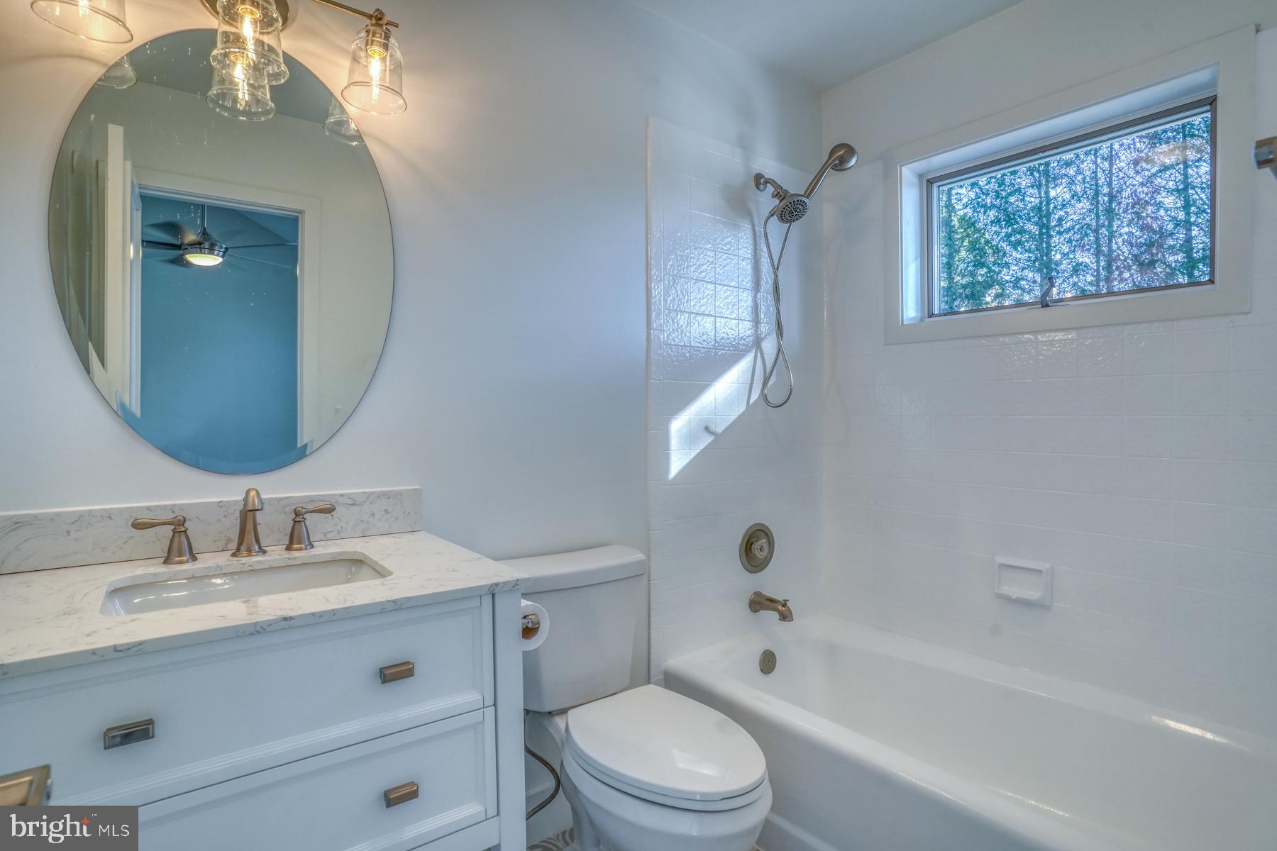 21 Sheffield Road Rehoboth Beach, DE 19971 - Photo 33 of 58 Bedroom two bathroom with tub and tile surround