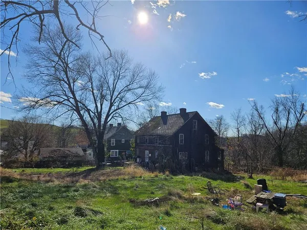 a view of a backyard of the house