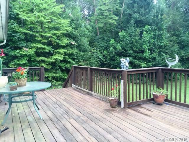 165 Valley Springs Road Olin, NC 28660 - Photo 8 of 21 a view of backyard with a deck