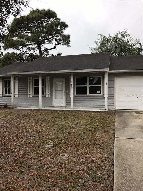 660 Cumberland Road Venice, FL 34293 - Photo 1 of 1 front view of a house with a yard