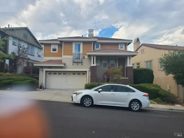 a car parked in front of a house