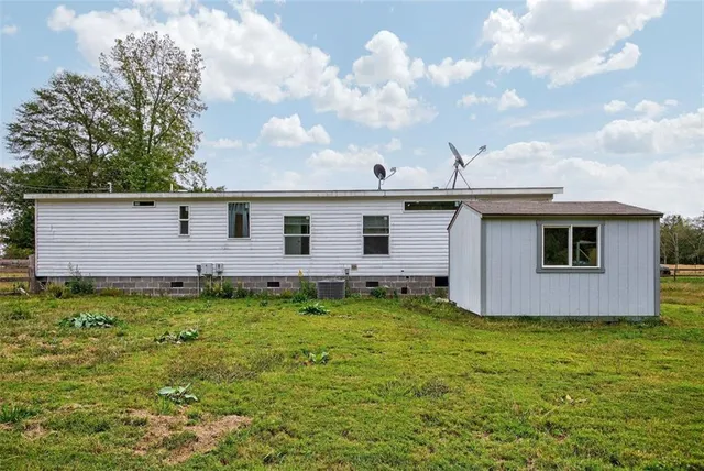 a view of a backyard of the house