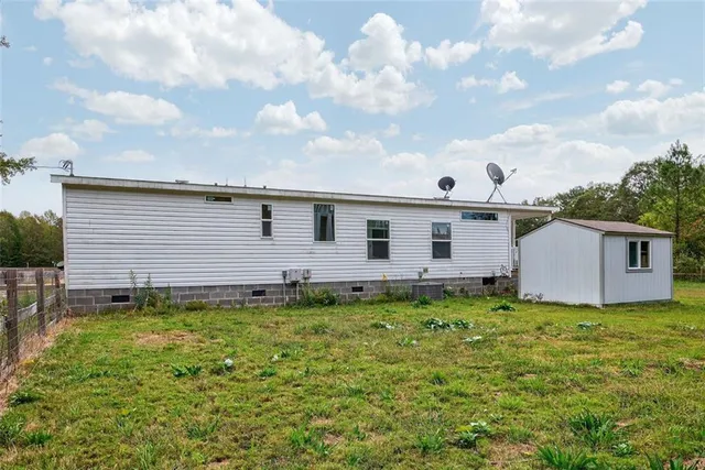 a view of a backyard of the house