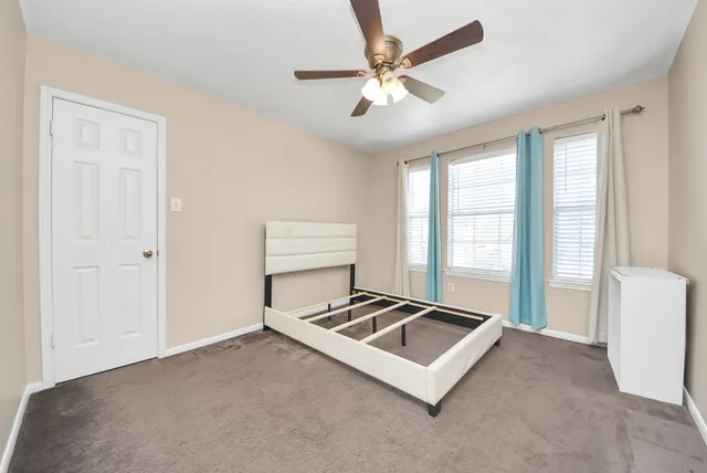 a living room with hard wood floor and a window