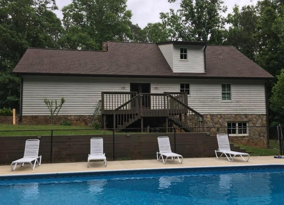 1075 Johnson Brady Road Canton, GA 30115 - Photo 11 of 33 a front view of a house with a garden