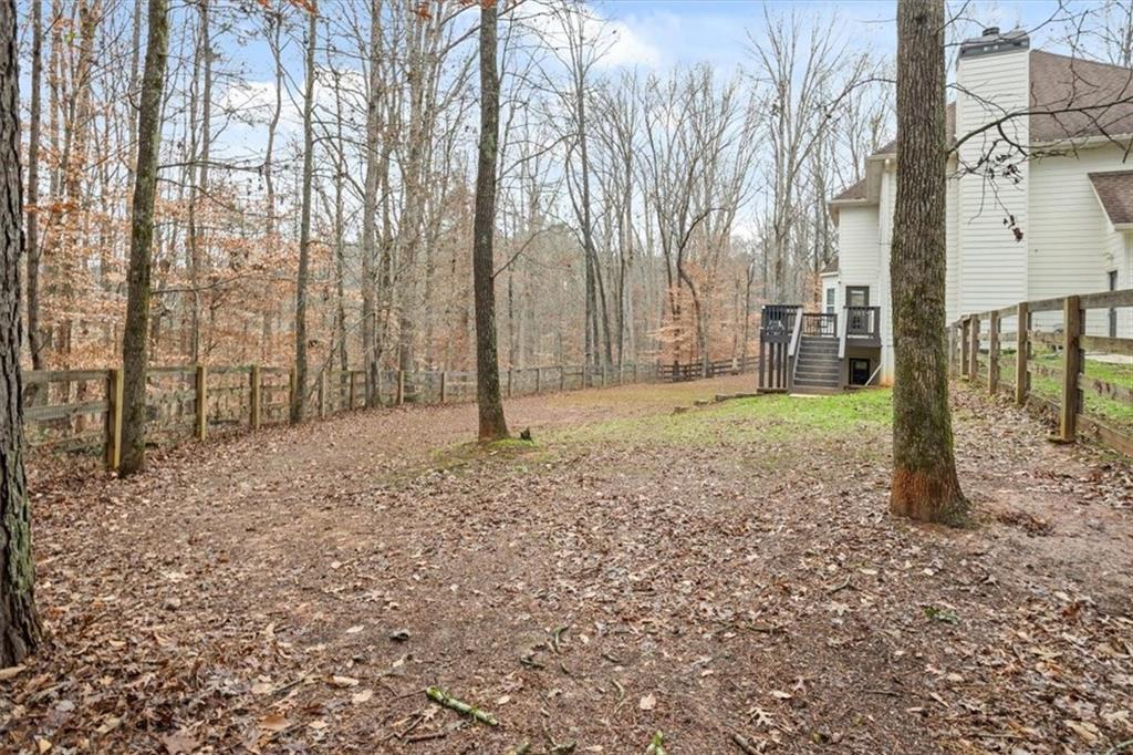 1075 Johnson Brady Road Canton, GA 30115 - Photo 18 of 33 a view of a yard with a tree