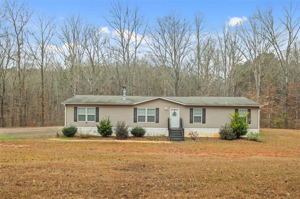 1075 Johnson Brady Road Canton, GA 30115 - Photo 22 of 33 a front view of a house with garden